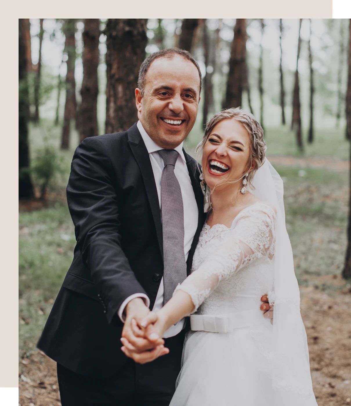 Happy couple on wedding day in forest